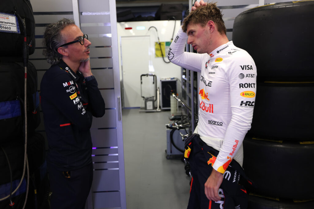 Red Bull team principal Laurent Mekies (left) speaking to driver Max Verstappen (right) in the garage after practice for the 2025 Formula 1 Azerbaijan Grand Prix