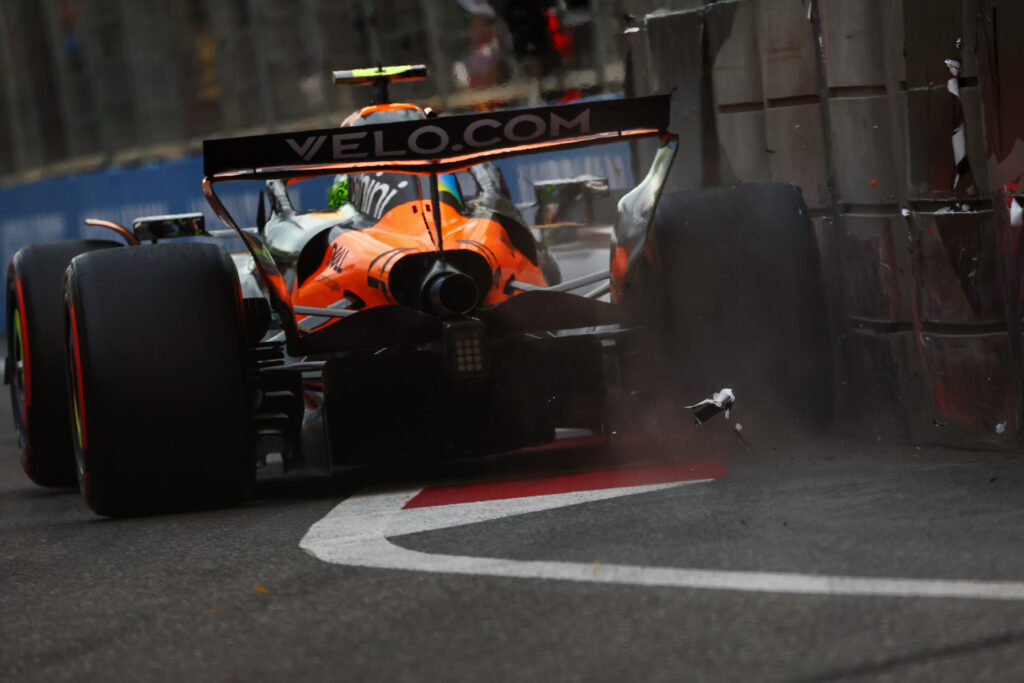 Lando Norris brushing the wall at turn 15 during qualifying for the Azerbaijan Grand Prix