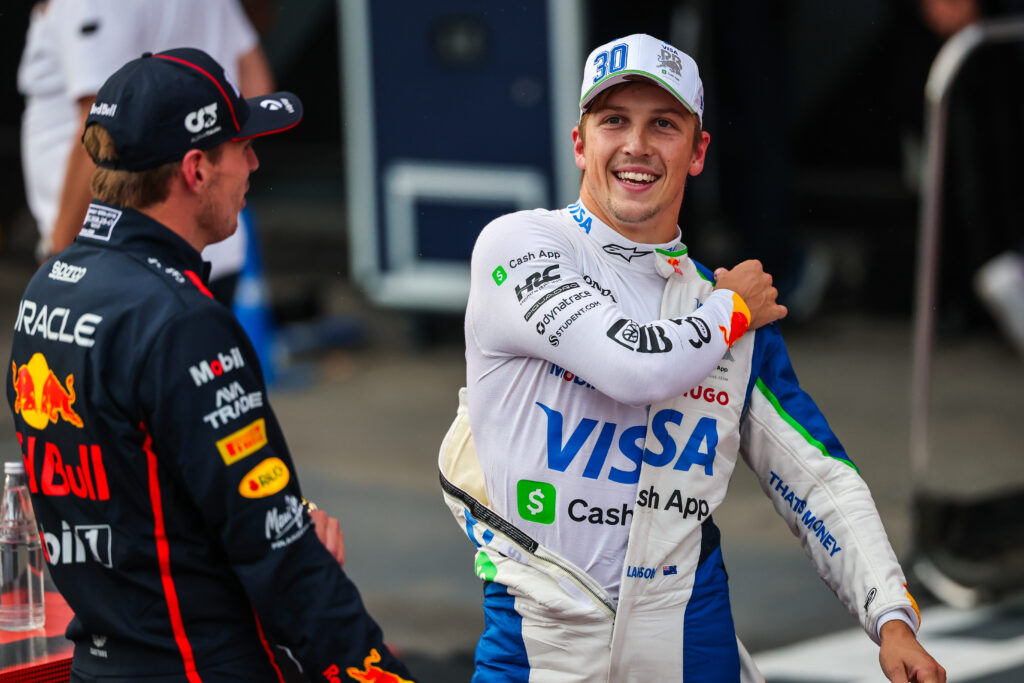 Racing Bulls driver Liam Lawson chatting with Red Bull driver Max Verstappen after qualifying for the 2025 Formula 1 Azerbaijan Grand Prix