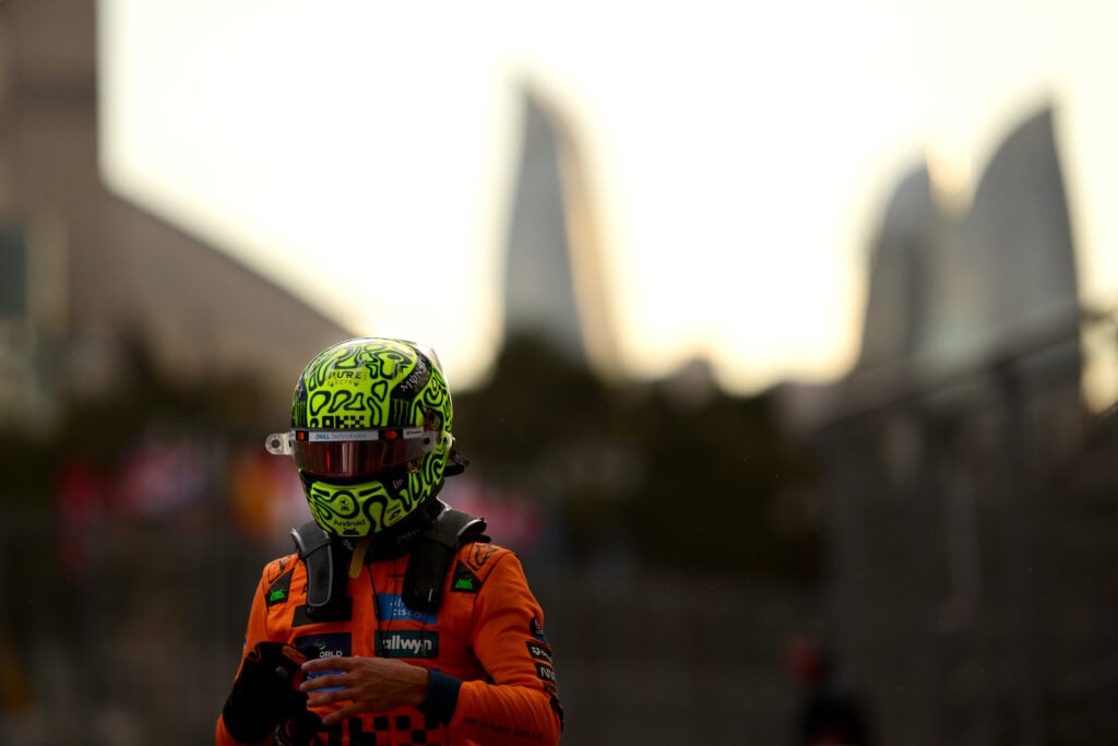 McLaren driver Lando Norris wearing his helmet after getting out of his car after qualifying for the 2025 Formula 1 Azerbaijan Grand Prix