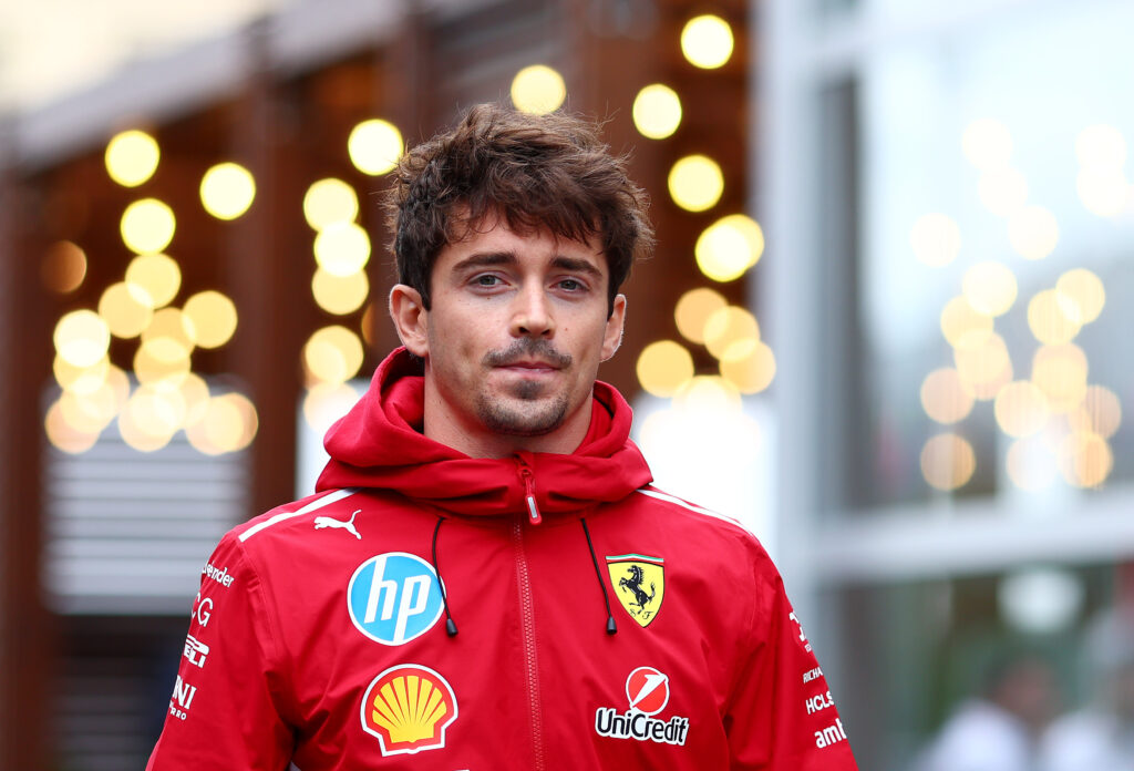 Ferrari driver Charles Leclerc arrives in the Baku paddock before the 2025 F1 Azerbaijan Grand Prix