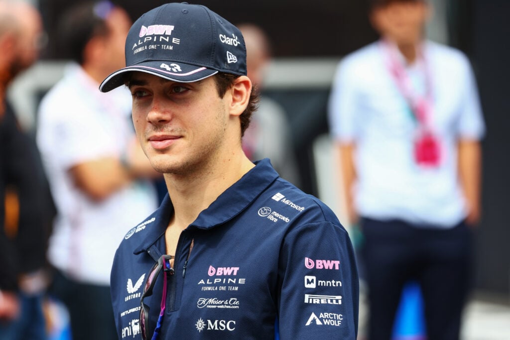 Alpine driver Franco Colapinto smiling in the paddock at the 2025 Formula 1 Azerbaijan Grand Prix