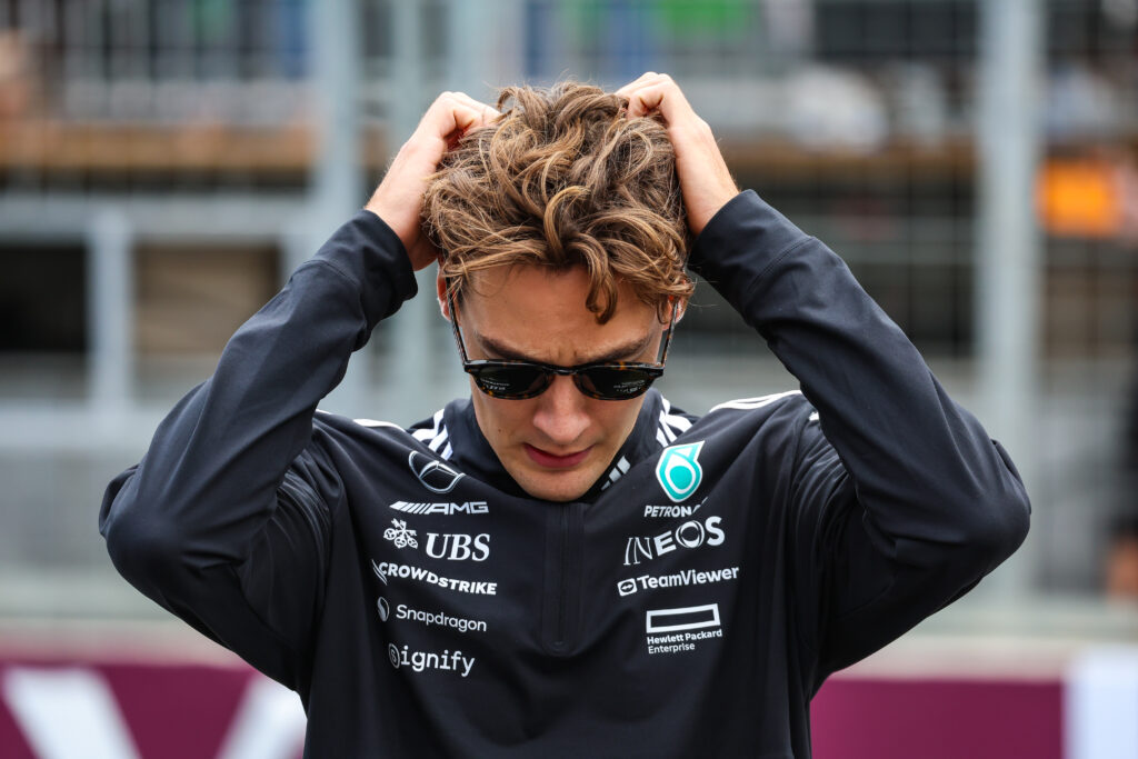 George Russel with his hands on his head ahead of the 2025 Azerbaijan Grand Prix.