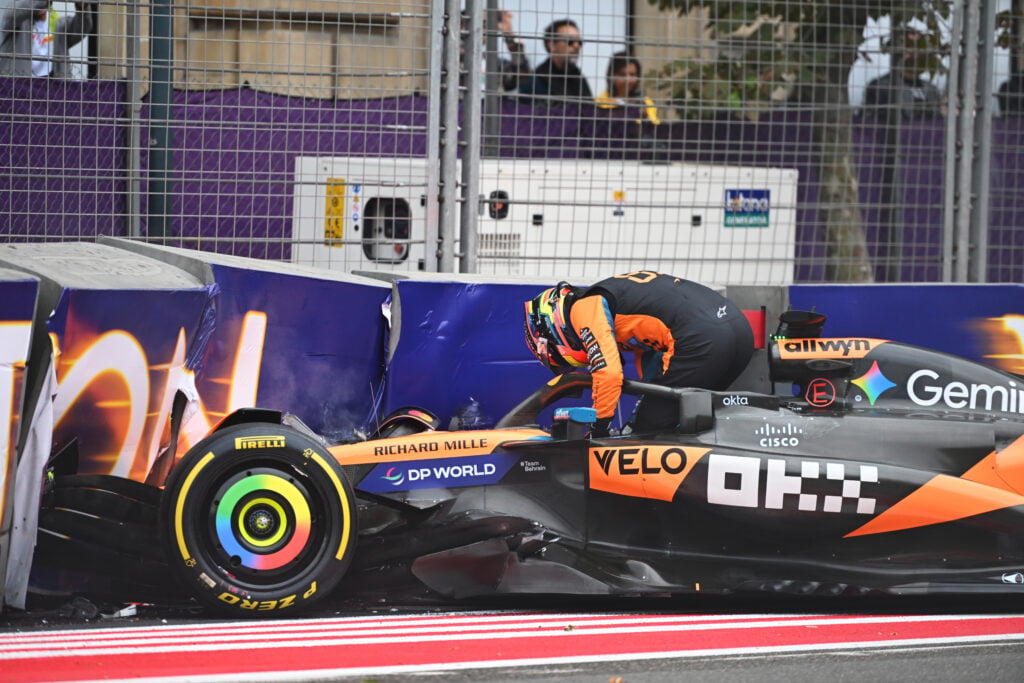 Oscar Piastri climbs out of his crashed McLaren during the 2025 F1 Azerbaijan Grand Prix