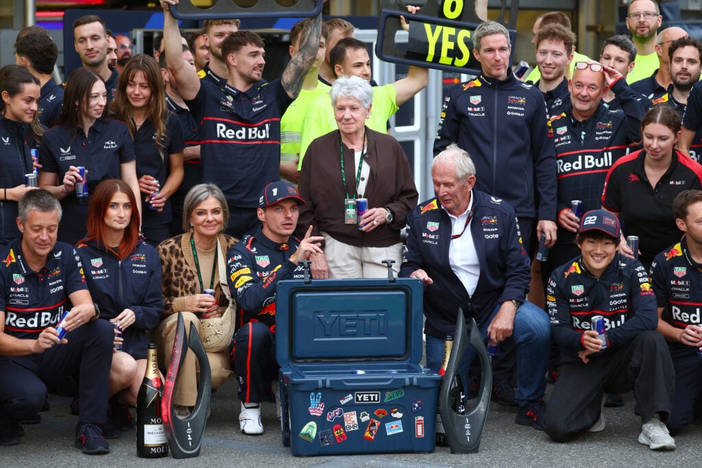 Red Bull staff and drivers preparing to take a team photo after Max Verstappen wins the 2025 Formula 1 Azerbaijan Grand Prix