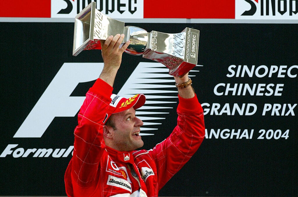 Ferrari driver Rubens Barrichello celebrating on the podium at the 2004 Formula 1 Chinese Grand Prix