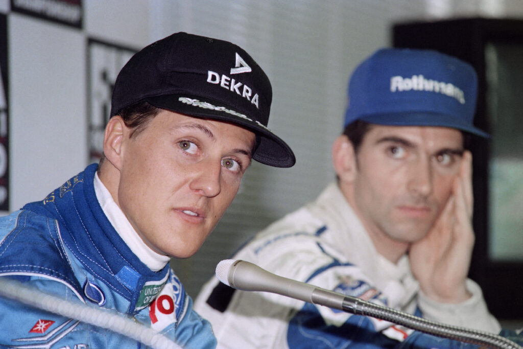 Michael Schumacher and Damon Hill look to the left of the image after the 1994 Japanese Grand Prix qualifying