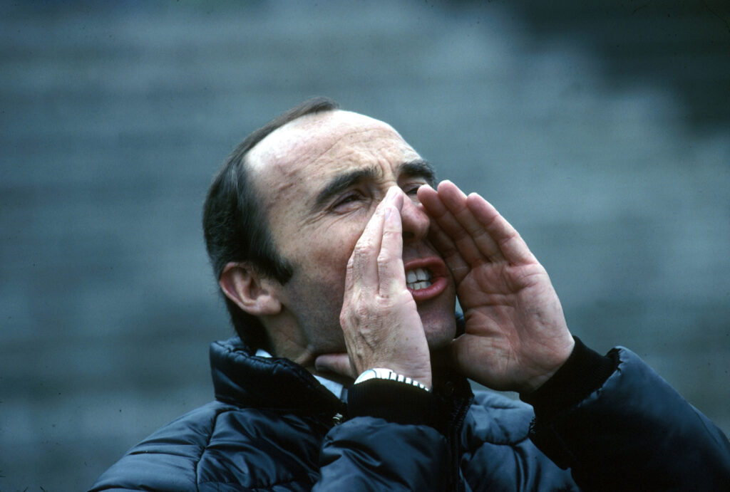 Williams team principal Frank Williams shouting at someone during the 1980 Formula 1 Belgian Grand Prix