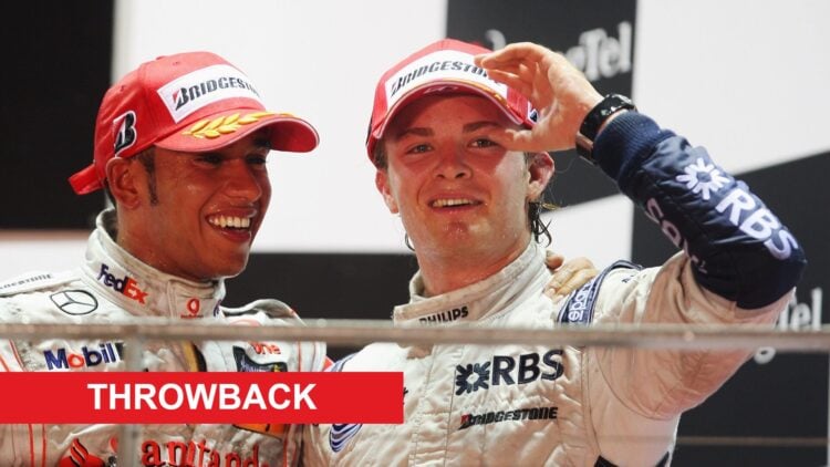 Lewis Hamilton of McLaren and Nico Rosberg of Williams celebrate at the 2008 Singapore Grand Prix