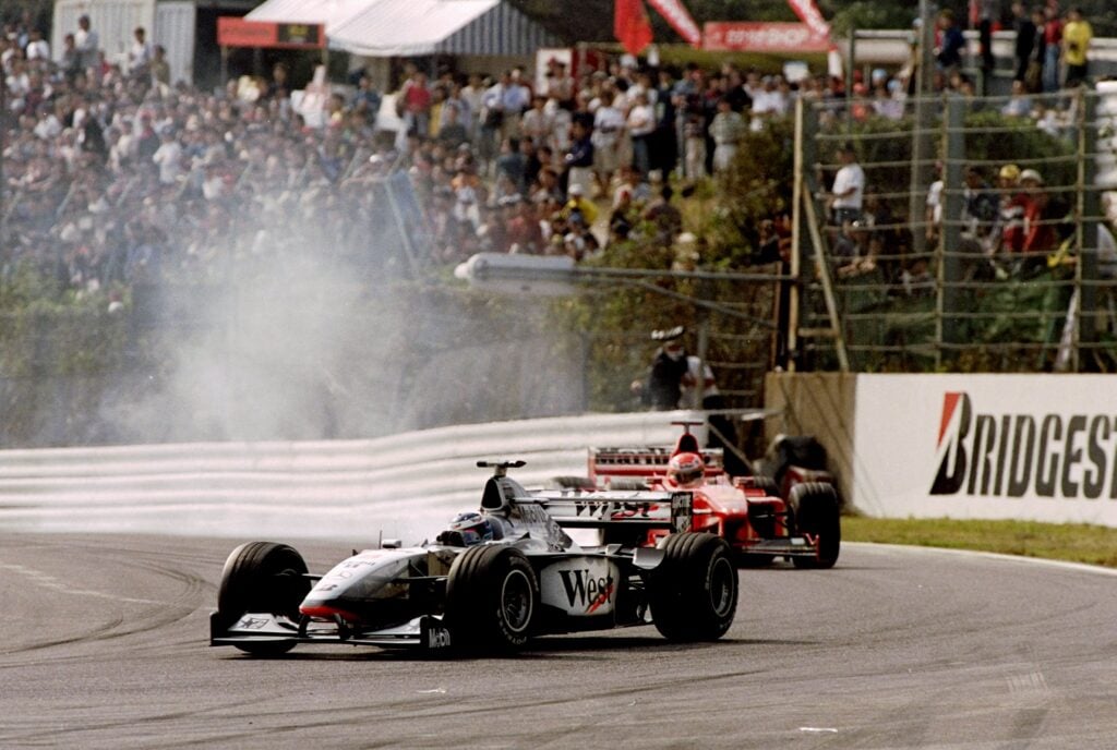 Mika Hakkinen leading Eddie Irvine at the 1998 Japanese Grand Prix following Michael Schumacher's puncture.