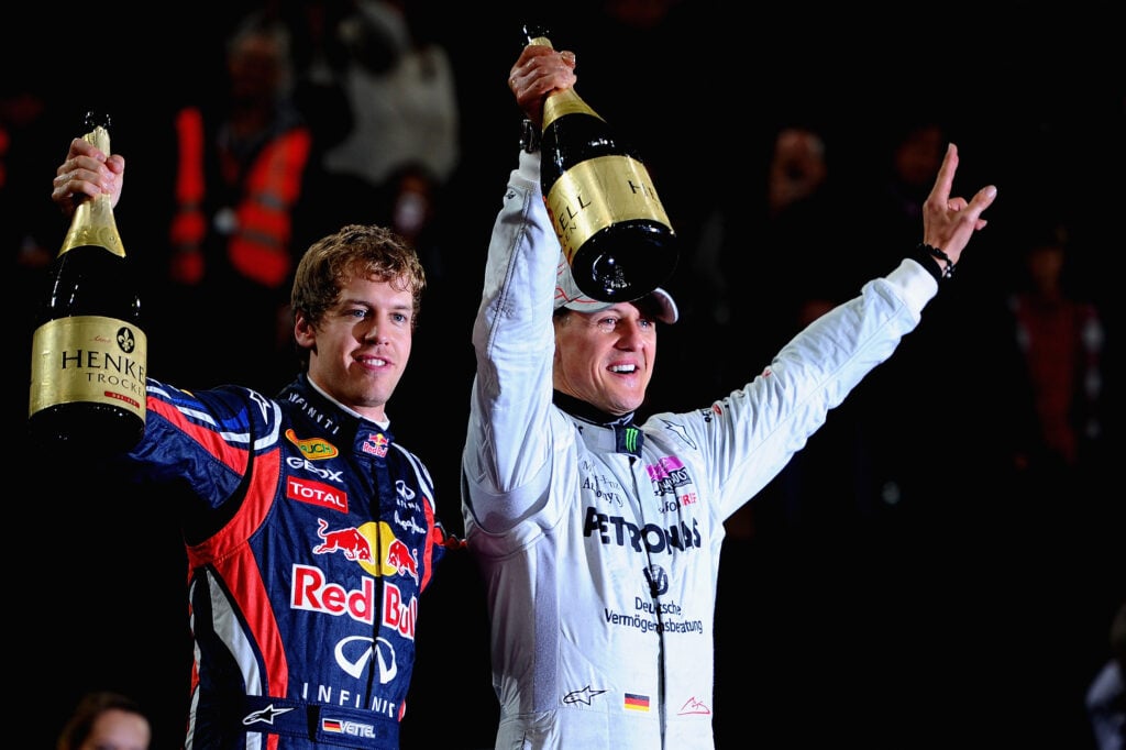 Red Bull driver Sebastian Vettel and Mercedes driver Michael Schumacher celebrating winning the Race of Champions