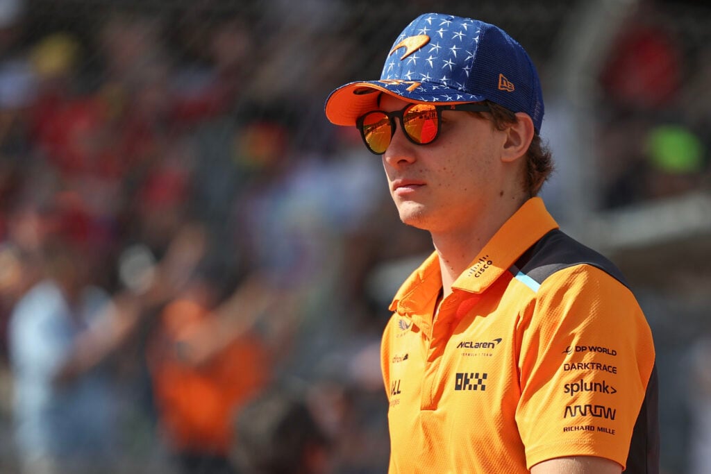 Oscar Piastri of McLaren wears sunglasses on the United States Grand Prix grid