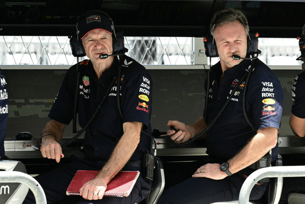 Adrian Newey and Christian Horner sitting on the pit wall at the 2024 Miami Grand Prix