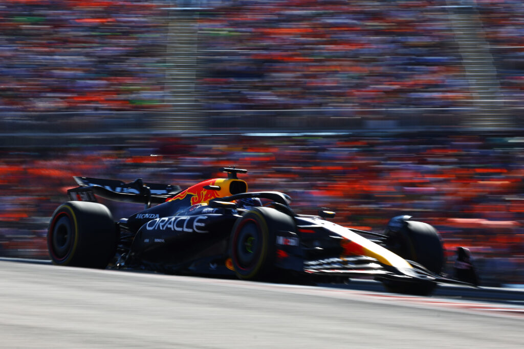 Max Verstappen's Red Bull speeds past grandstands at the United States Grand Prix