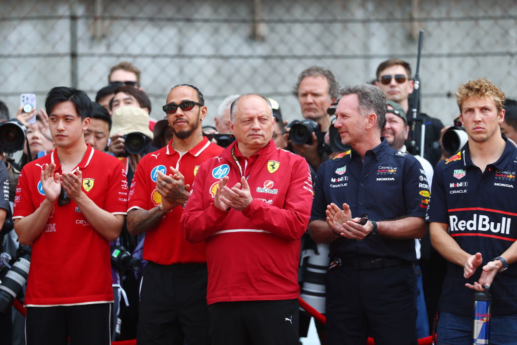 Ferrari's Fred Vasseur and Red Bull's Christian Horner applaud during a tribute to Eddie Jordan before the 2025 F1 Chinese Grand Prix