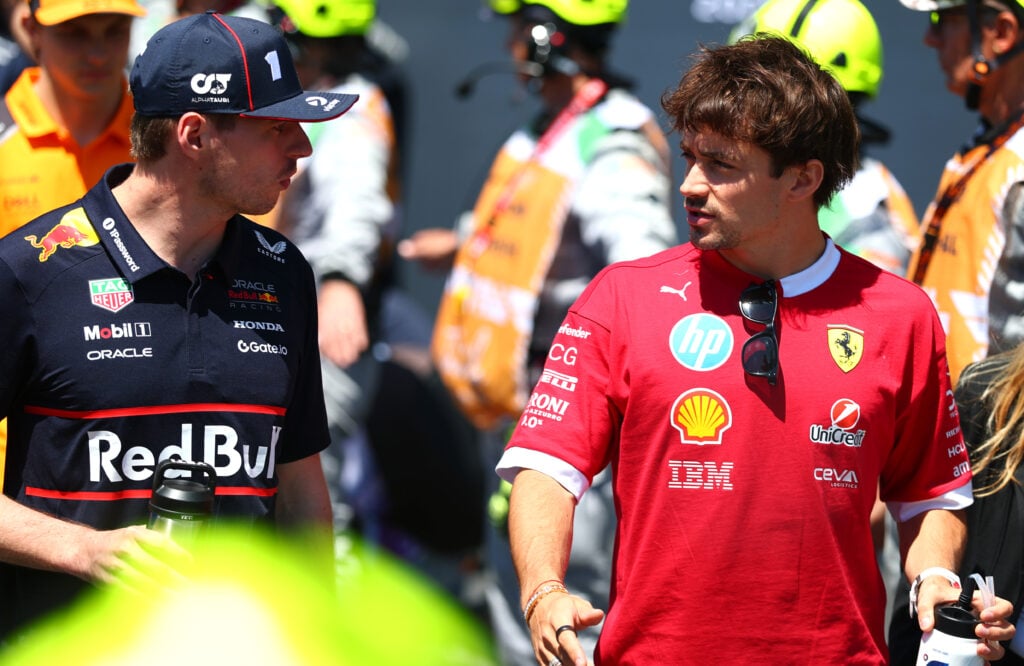 Red Bull driver Max Verstappen (left) speaking to Ferrari driver Charles Leclerc (right) at the 2025 Formula 1 Emilia Romagna Grand Prix