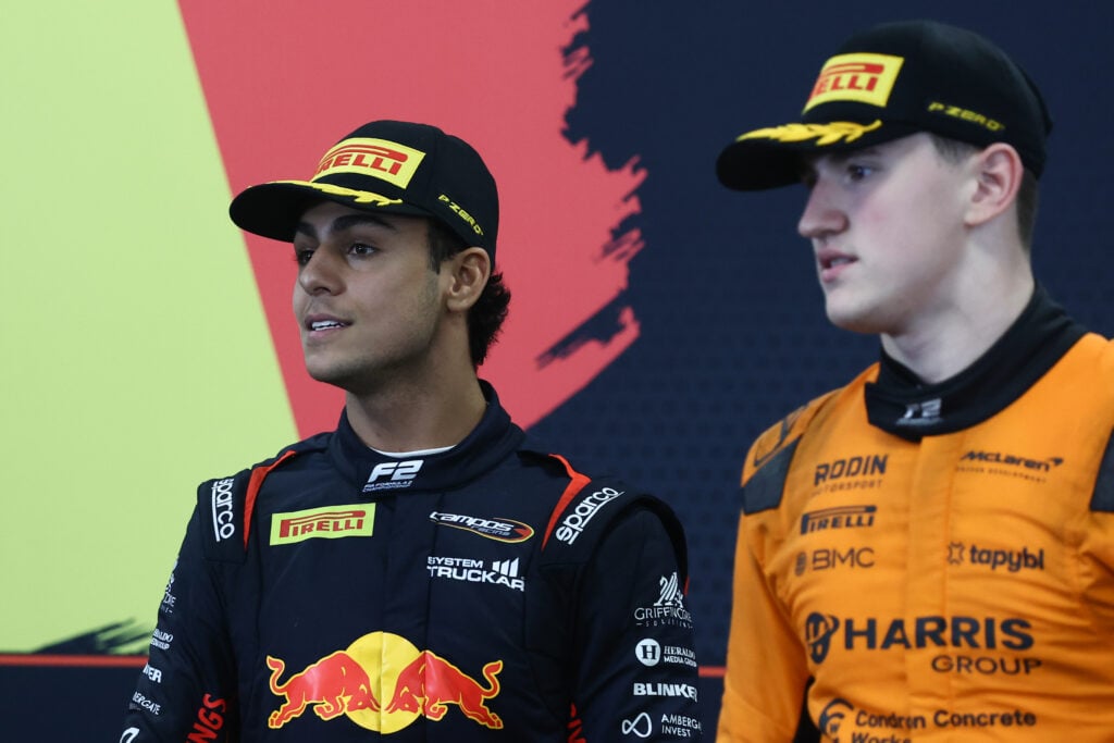 Red Bull junior Arvid Lindblad speaks with Alex Dunne during the 2025 F2 round in Belgium