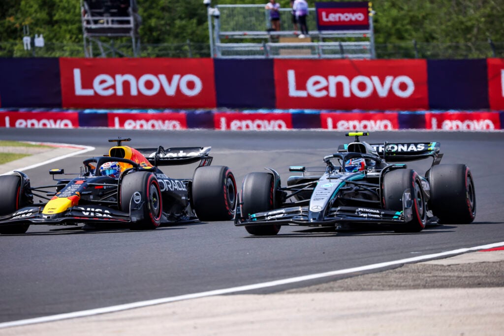 Red Bull Racing driver Max Verstappen driving alongside Mercedes driver Andrea Kimi Antonelli at the 2025 Formula 1 Hungarian Grand Prix