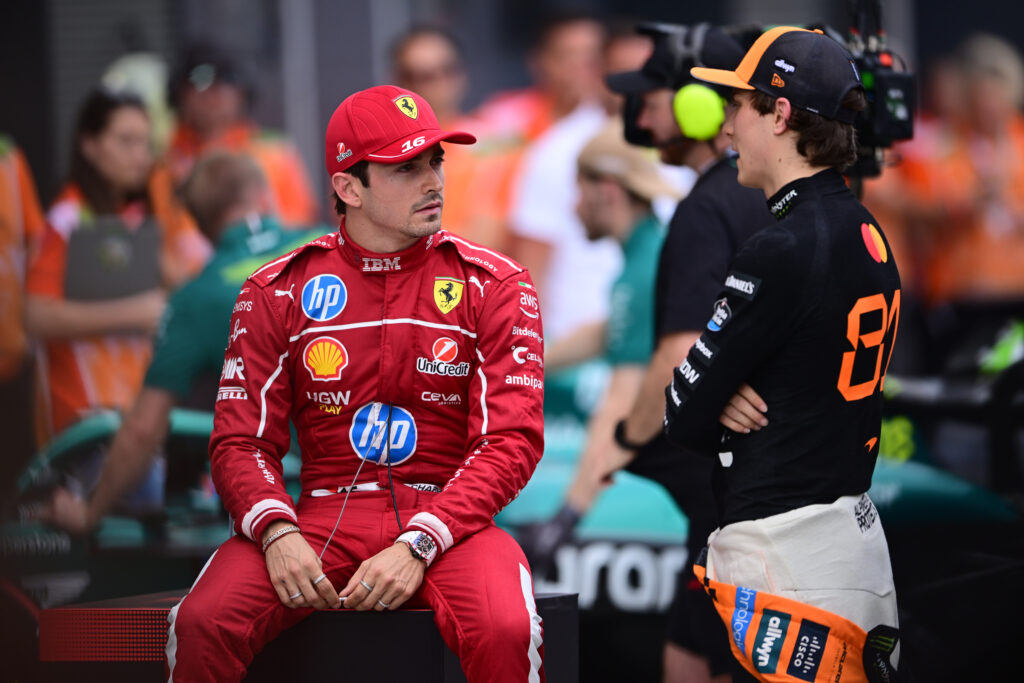 Ferrari driver Charles Leclerc speaking to McLaren driver Oscar Piastri after qualifying for the 2025 F1 Hungarian Grand Prix