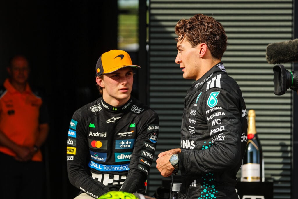 McLaren driver Oscar Piastri speaking to Mercedes driver George Russell at the 2025 Formula 1 Hungarian Grand Prix