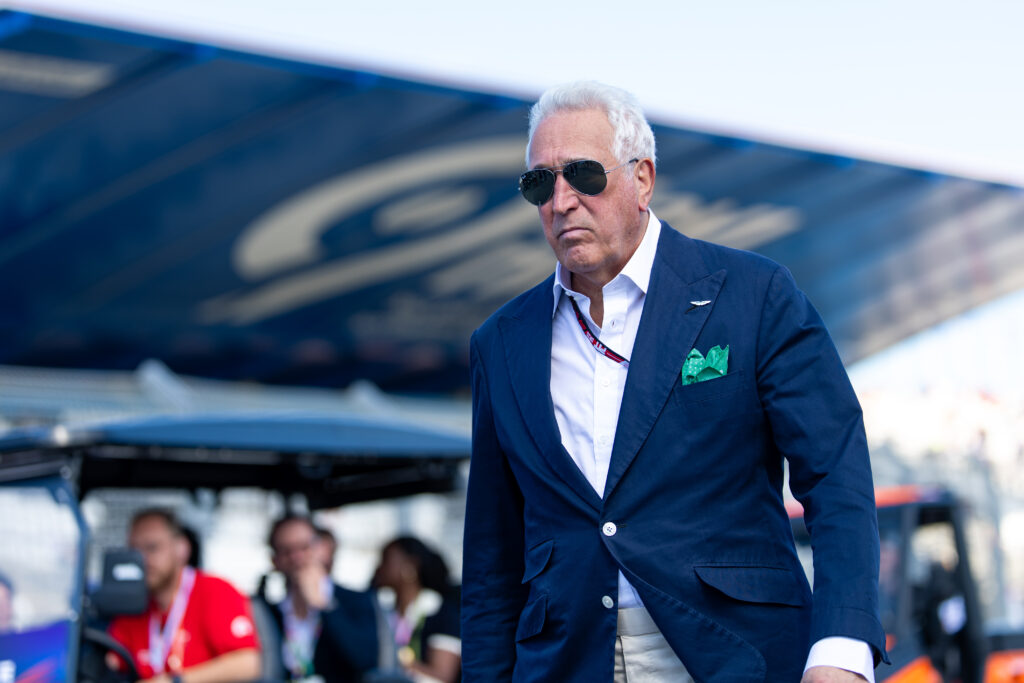 Lawrence Stroll of Aston Martin walks through the Dutch Grand Prix paddock
