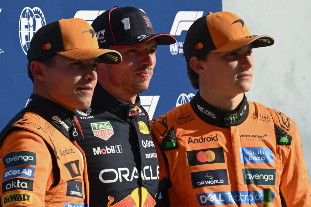 Red Bull's Max Verstappen celebrates scoring pole at Monza with McLaren's Lando Norris and Oscar Piastri after qualifying for the 2025 F1 Italian Grand Prix