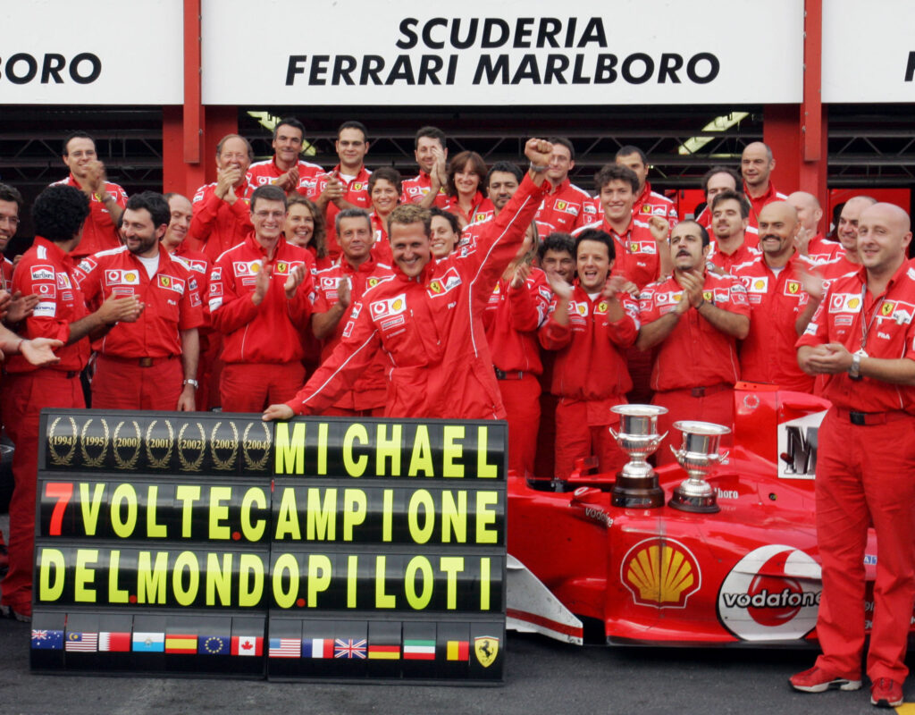 Ferrari's Michael Schumacher celebrates winning the 2004 F1 title after finishing the Belgian Grand Prix in P2