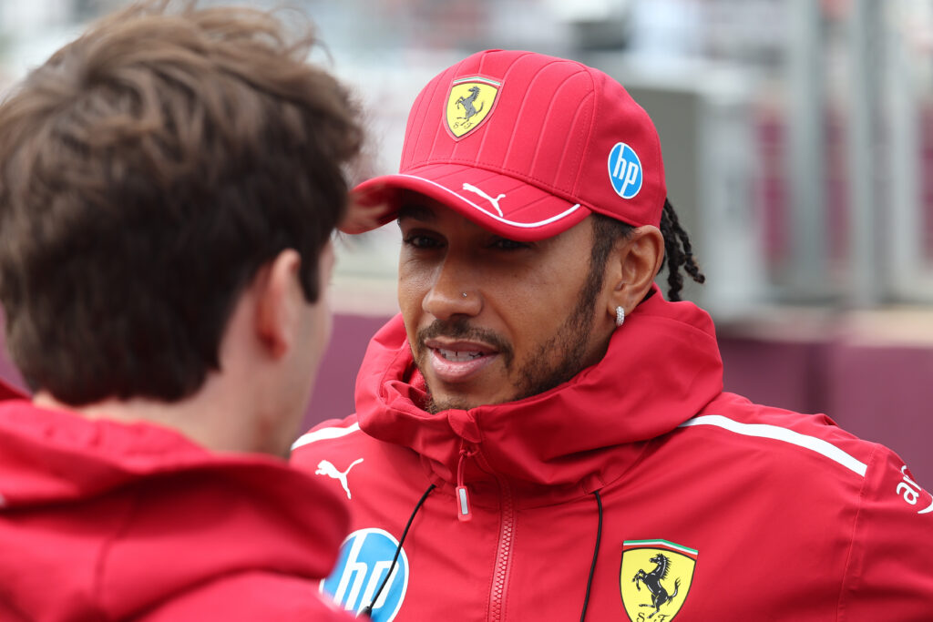 Lewis Hamilton talks to Ferrari teammate Charles Leclerc ahead of the 2025 Azerbaijan Grand Prix