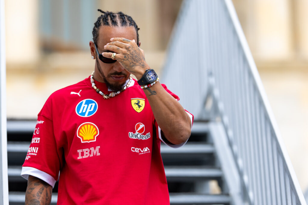 Ferrari driver Lewis Hamilton covering his face in the Baku paddock at the 2025 F1 Azerbaijan Grand Prix