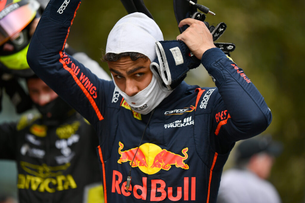 Red Bull junior driver Arvid Lindblad taking off his helmet at the 2025 Formula 2 Azerbaijan Grand Prix