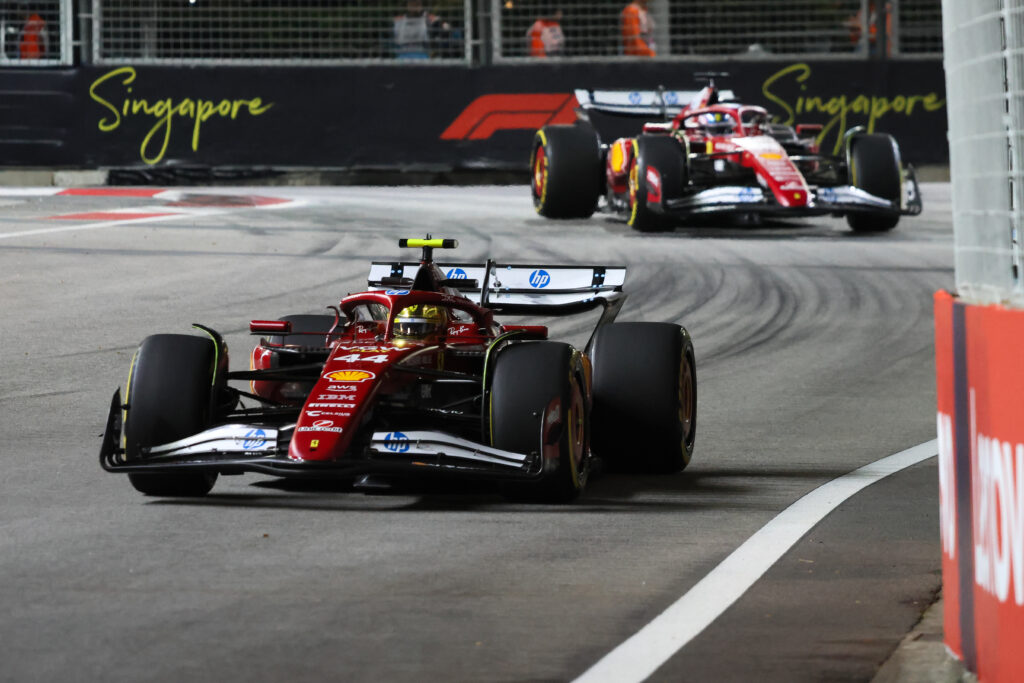 Ferrari's Lewis Hamilton leads teammate Charles Leclerc on track during the 2025 F1 Singapore Grand Prix