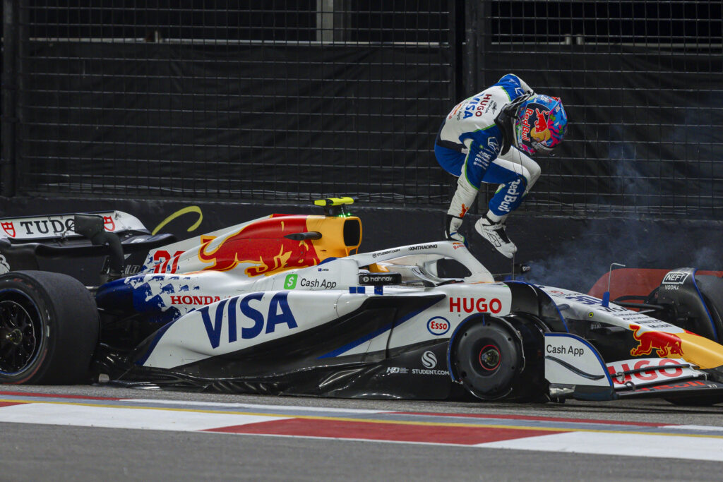 Racing Bulls driver Liam Lawson jumping out of his car after crashing at the 2025 Singapore Grand Prix