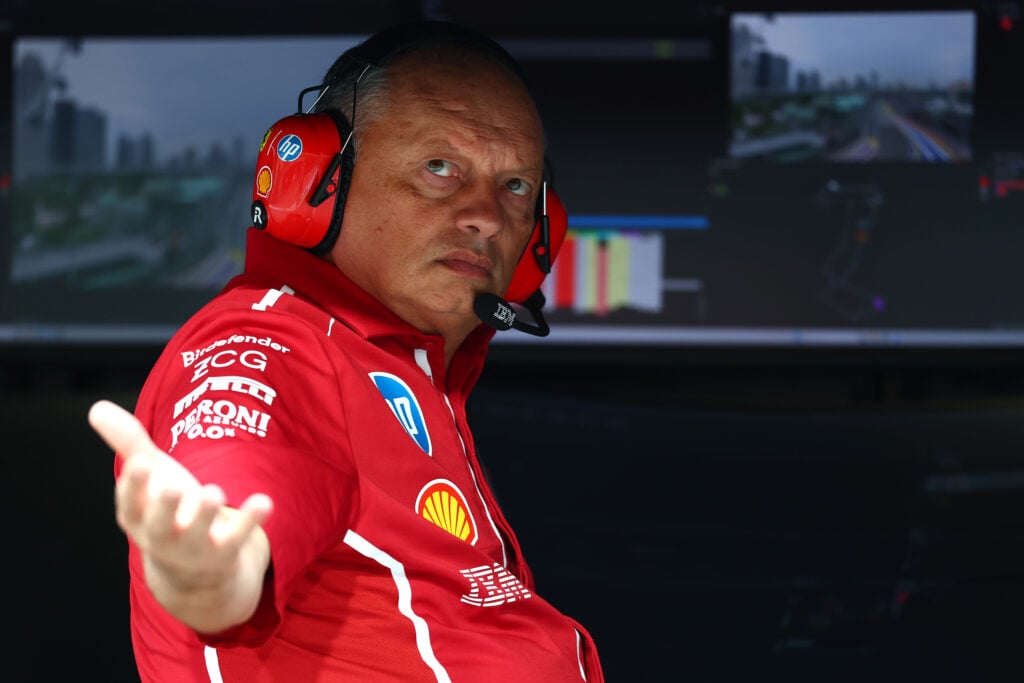 Ferrari team principal Frederic Vasseur checking for rain from the pit wall at the 2025 Formula 1 Singapore Grand Prix