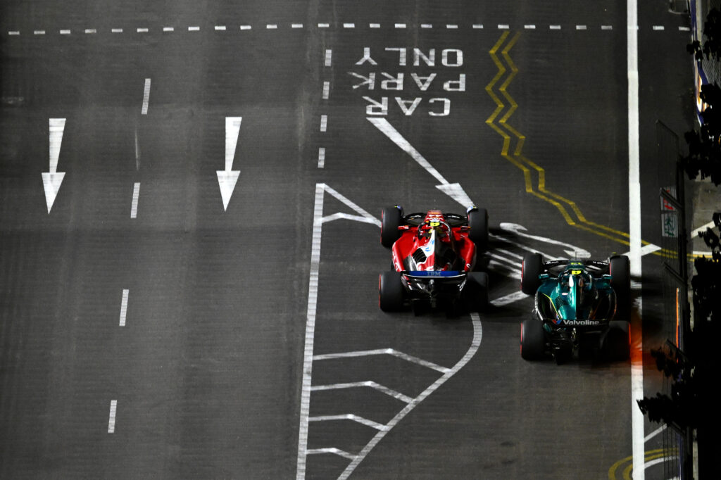 Ferrari driver Lewis Hamilton and Aston Martin driver Fernando Alonso side by side at the 2025 Formula 1 Singapore Grand Prix