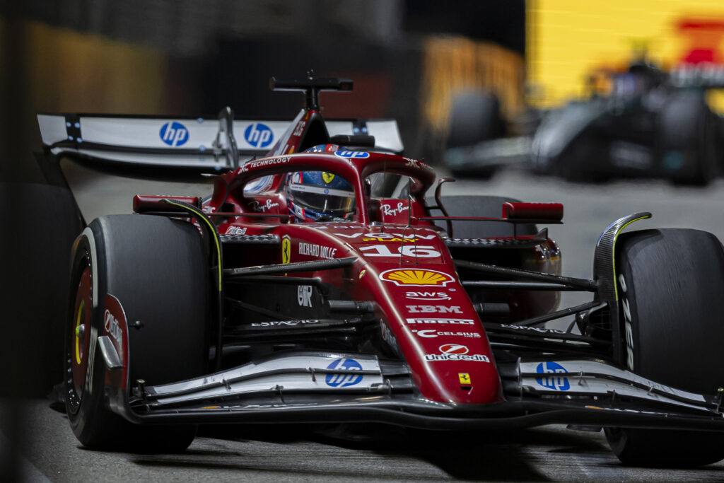 A close up of Ferrari driver Charles Leclerc racing at the 2025 Formula 1 Singapore Grand Prix