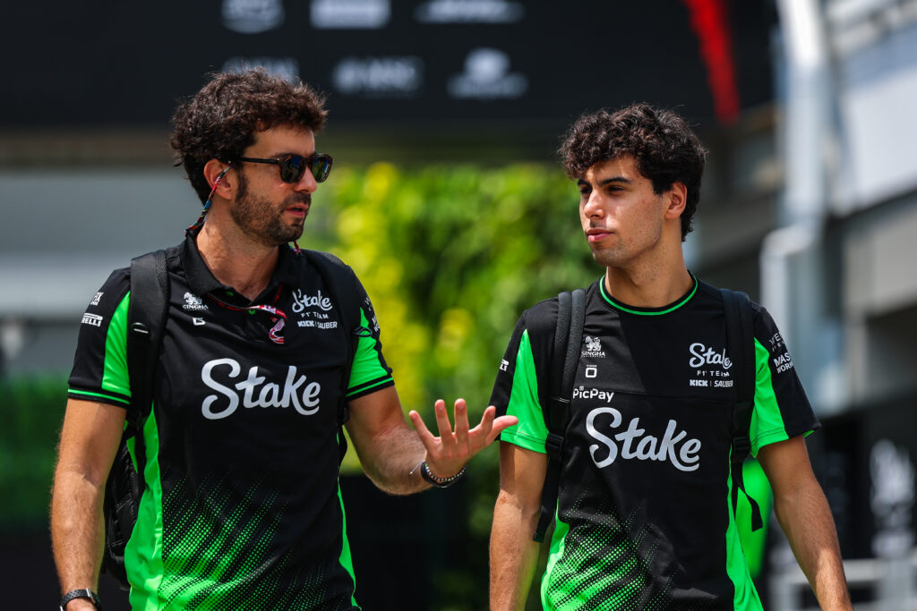 Sauber driver Gabriel Bortoleto in conversation in the paddock at the 2025 Formula 1 Singapore Grand Prix