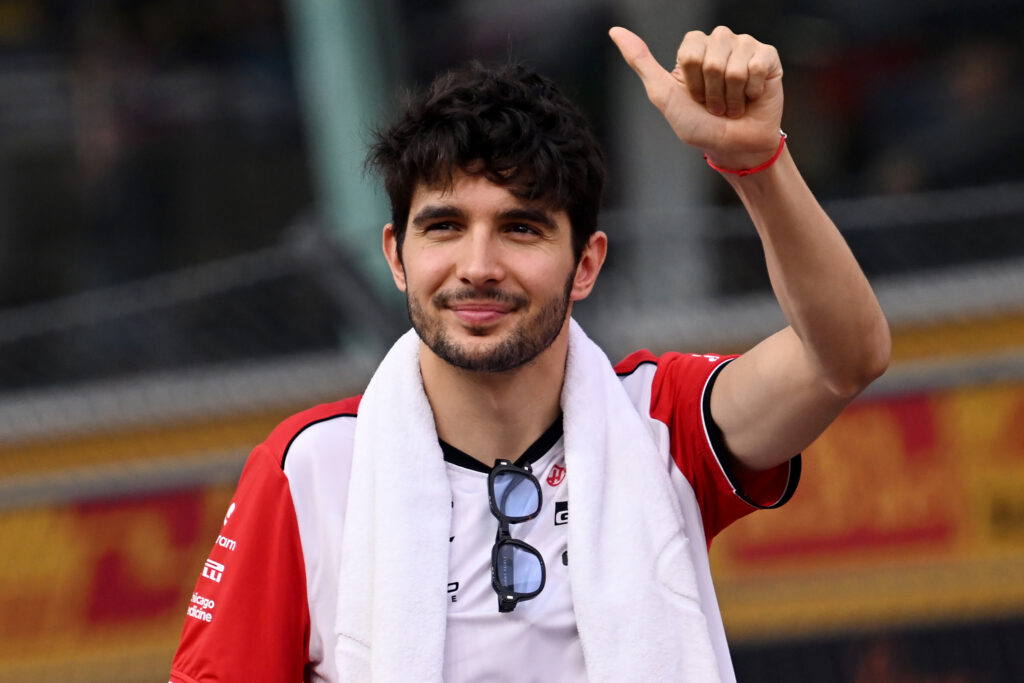 Haas' Esteban Ocon gives fans a thumbs up before the drivers' parade at the 2025 F1 Singapore Grand Prix