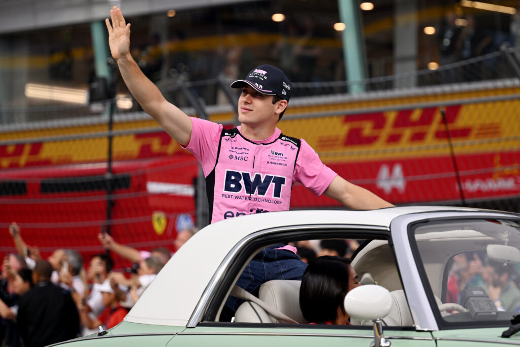 Alpine driver Franco Colapinto waving to the crowd at the 2025 Formula 1 Singapore Grand Prix