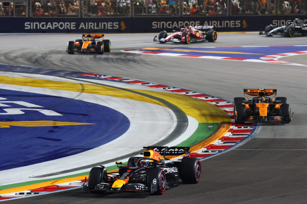 Max Verstappen of Red Bull driving ahead of Lando Norris at the 2025 Singapore Grand Prix