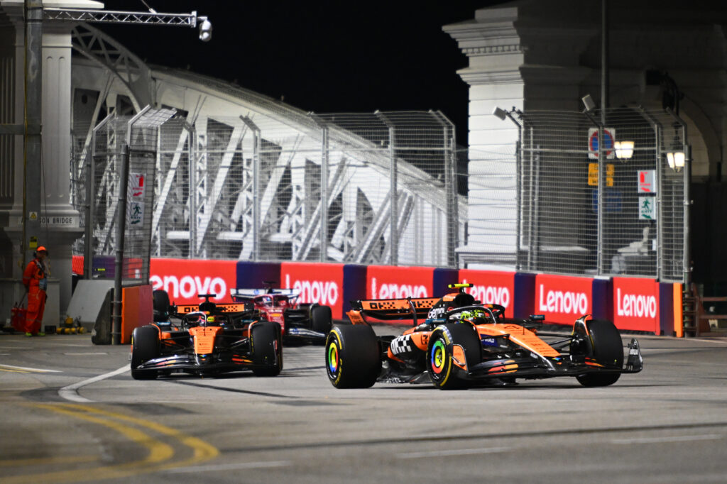 McLaren drivers Lando Norris and Oscar Piastri racing at the 2025 Formula 1 Singapore Grand Prix