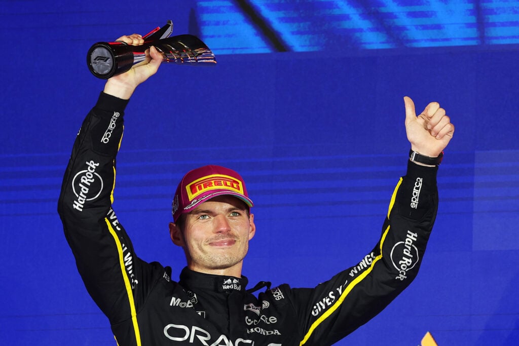 Red Bull driver Max Verstappen celebrates his P2 finish on the 2025 F1 Singapore Grand Prix podium