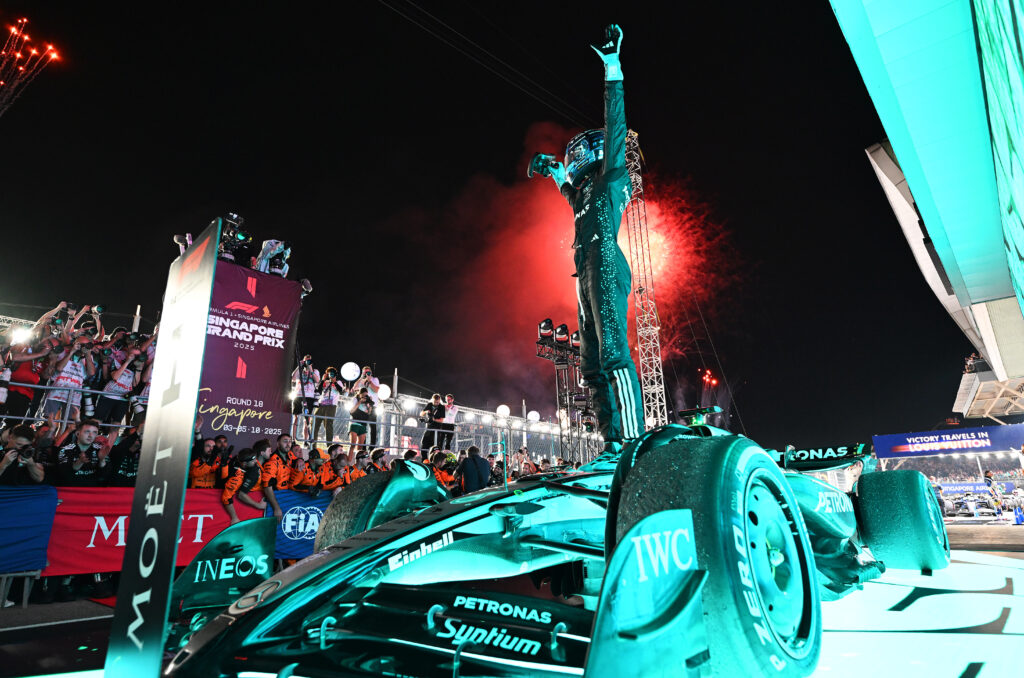 George Russell of Mercedes celebrates in parc ferme after winning the 2025 Singapore Grand Prix