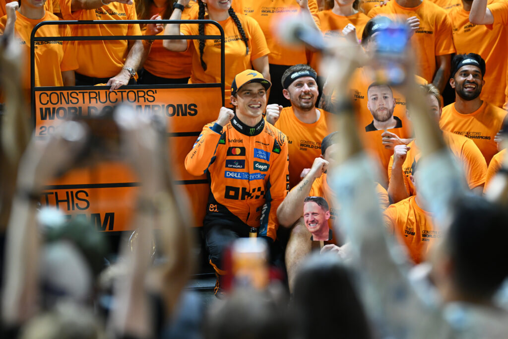 Oscar Piastri celebrates with his team after McLaren won the 2025 F1 constructors' championship at the Singapore Grand Prix