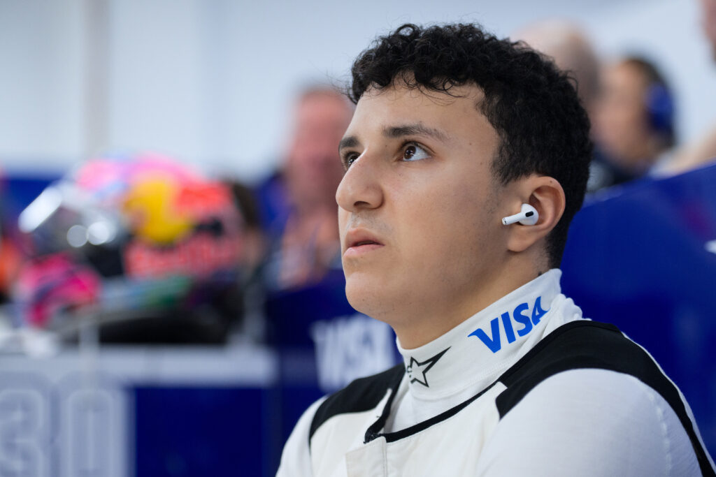 Racing Bulls driver Isack Hadjar looking up at the 2025 Formula 1 Singapore Grand Prix