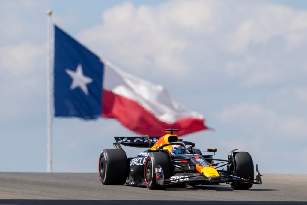 Max Verstappen drives Red Bull past Texas flag at the United States Grand Prix practice session