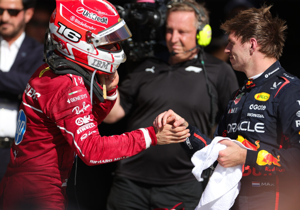 Ferrari driver Charles Leclerc shaking hands with Red Bull driver Max Verstappen at the 2025 Formula 1 United States Grand Prix