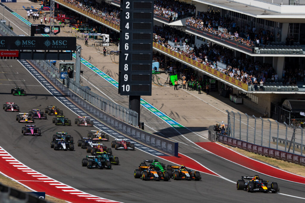 Red Bull's Max Verstappen leads McLaren's Lando Norris and Oscar Piastri at the start of COTA Sprint at the 2025 F1 United States Grand Prix