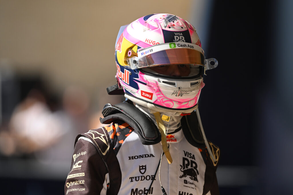 Liam Lawson of Racing Bulls wears his helmet in parc ferme at the US Grand Prix