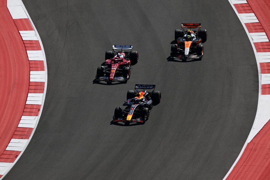 Red Bull's Max Verstappen leads Ferrari's Charles Leclerc and McLaren's Lando Norris on track at the start of the 2025 F1 United States Grand Prix