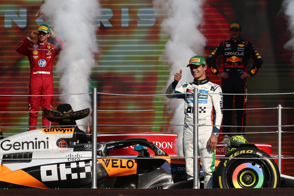 McLaren driver Lando Norris celebrates winning the 2025 F1 Mexico City Grand Prix on the podium